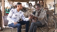 Kwabena Josiah speaking with Kofi Adoma