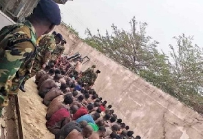 Some residents of Ashaiman lined up after a military swoop