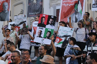 Tunisian protesters march in central Tunis calling for the release of the activists detained