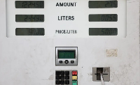 The price of gasoline is displayed on a dispenser, on the verge of a rise in petrol prices in Iran
