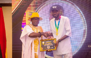Daniel Amoako Antwi, [R]  Executive Director of Africa Skills Hub Foundation. receiving an award