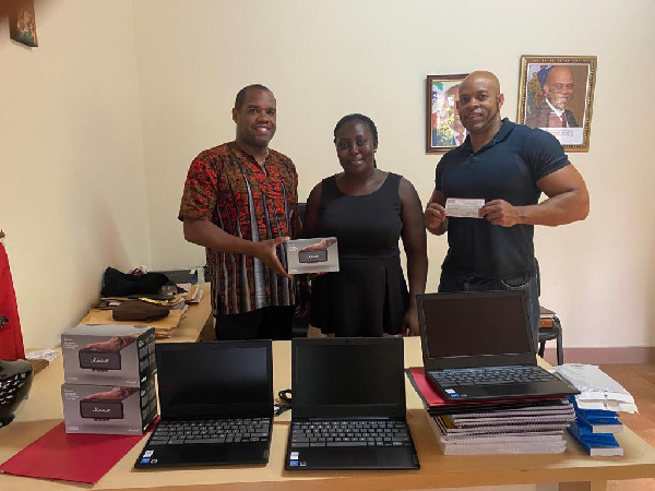 Jonathan F Austin and Phillip Belcher with  Mrs Victoria Agyemang-Mensah of the Bridge Foundation