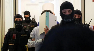 Beran A was led into court in Wiener Neustadt escorted by masked security officials