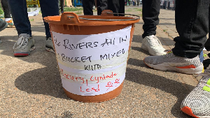 The famous bucket containing water from all the 16 affected rivers in Ghana