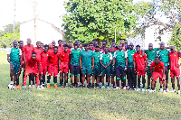 Abedi Pele in a photo with players and officials of Asante Kotoko