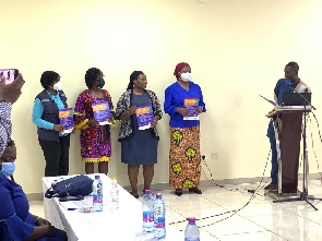 Dr. Ayifah and other partners launching the report put together by SEND GHANA and PTF