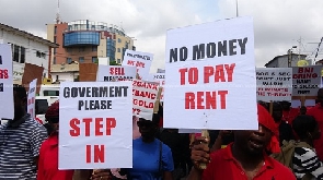 Mengold customers holding placards during a demonstration