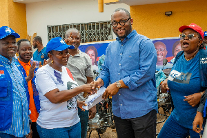 Manuel Sawyerr presenting the items to the MP for the area, Lydia Seyram Alhassan