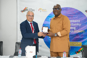 Consultant Mohamed Benjelloun (L) with the GIPC CEO Simon Madjie
