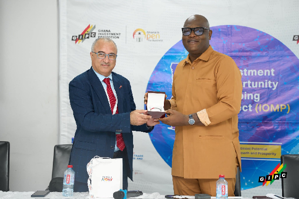 Consultant Mohamed Benjelloun (L) with the GIPC CEO Simon Madjie