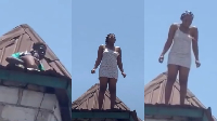 Young Nigerian woman stands on roof of uncompleted building in apparent suicide attempt