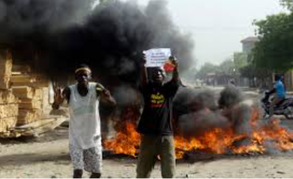 Two men protest on a street in N'Djamena, Chad, Tuesday, April 27, 2021