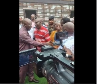 Otumfuo Osei Tutu II (left) in a handshake with one of the club legends