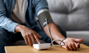 File photo of a person checking his blood pressure