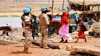 UN peacekeeping mission soldiers patrol on foot in the streets of Gao, Mali