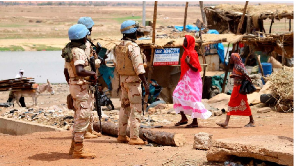 UN peacekeeping mission soldiers patrol on foot in the streets of Gao, Mali