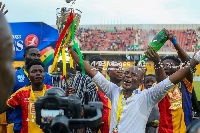 Hearts of Oak assistant coach, David Ocloo celebrating President's Cup win with players