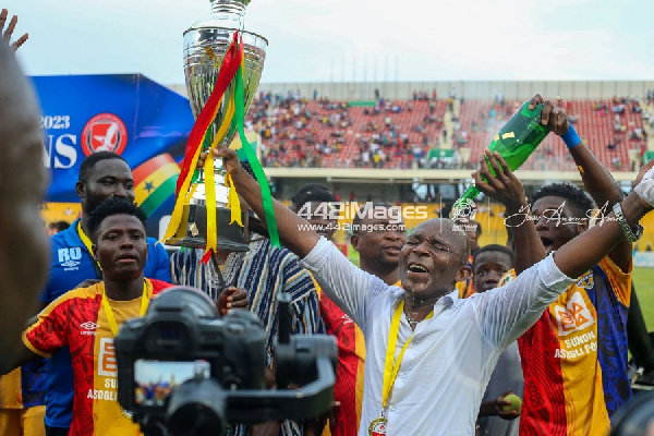 Hearts of Oak assistant coach, David Ocloo celebrating President's Cup win with players