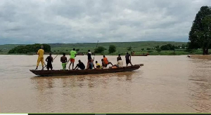 Farm workers rely on boats to get to rice fields and to transport goods