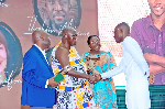 Otumfuo Osei Tutu II (second from left) shaking the hands of Yaw Owusu