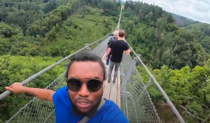 David Oscar Dogbe walks on Geierlay suspension bridge in Mörsdorf, Germany