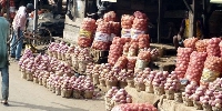 Some onions on display at a market