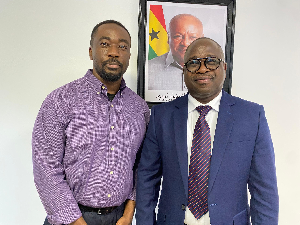 GhanaWeb CEO, David Antwi with the Minister of Climate Change and Sustainability