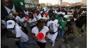 Supporters of Senegalese presidential candidate Khalifa Sall dance alongside during his campaign