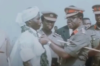 DK Poison being decorated with a Grand Medal by General Ignatius Kutu Ache