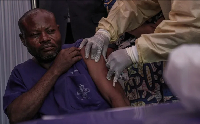 A clinician administers the mpox vaccine to a hospital staff member during the launch