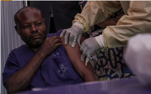 A clinician administers the mpox vaccine to a hospital staff member during the launch