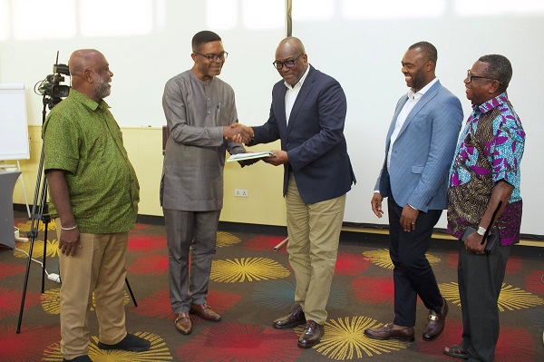 Dr Emmanuel Akwetey (2nd from left), presenting the memorandum to Prof Kwesi Prempeh