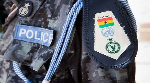 File photo of badge on police uniform.