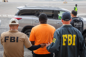 Dada Joe Remix (In orange shirt) has been extradited to the US