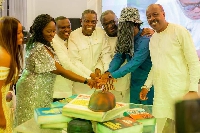 Kwesi Pratt Jnr (fourth left) cuts his 70th birthday cake with wellwishers
