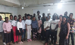 Dr. Ayew Afriye in a group photograph with some of the student journalists