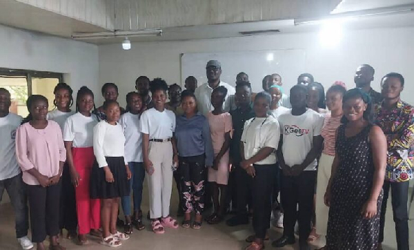 Dr. Ayew Afriye in a group photograph with some of the student journalists