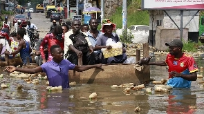 Residents in Kinshasa have been using canoes on the city's flooded roads