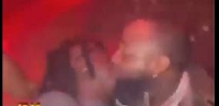 Davido kissing Stonebwoy