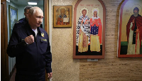 Russia's President Vladimir Putin visits the Russian navy's guided missile cruiser Varyag