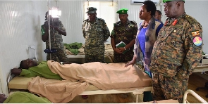 The ATMIS Force Commander, Lt Gen Sam Okiding (right) visits soldiers wounded in the May 26 attack