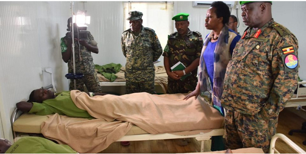 The ATMIS Force Commander, Lt Gen Sam Okiding (right) visits soldiers wounded in the May 26 attack