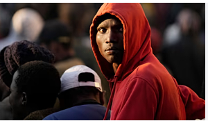 A Malawian migrant stands in a queue ahead deportation at a temporary centre in Durban, South Africa A Malawian migrant stands in a queue ahead deportation at a temporary centre in Durban, South Africa