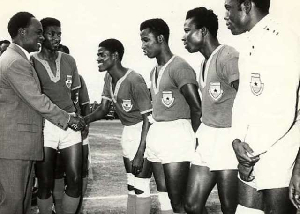 Image of Kwame Nkrumah exchanging pleasantries with Black Stars players