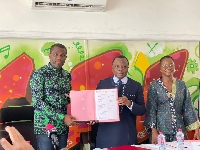 Mark Okraku-Mantey, H.E Jules Armand Aniambossou, Gyankroma Akufo-Addo after signing the MoU