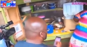 Vice President Dr. Mahamudu Bawumia buying waakye