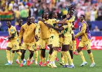 Players of the Black Stars celebrating a goal