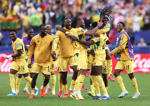 Players of the Black Stars celebrating a goal