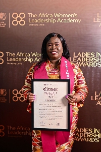 Dr. Juliana Oye Ameh, CEO of Trust Hospital with her citation at AWLA