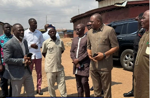Dr Pelpuo with some dignitaries of the Ministry and MDPI inspecting the land